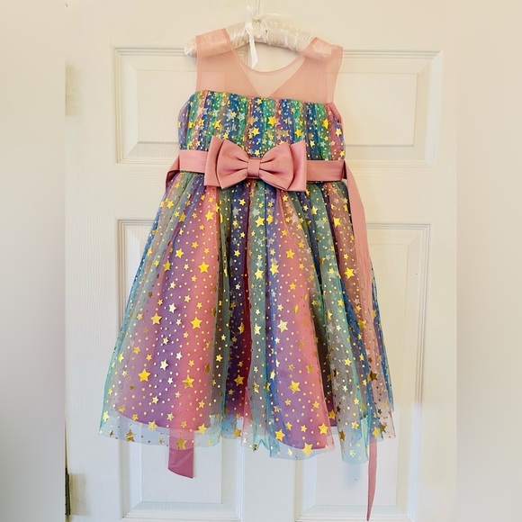 None Other - Gorgeous dress with tulle and stars and a big bow girls size 6/7 has a stain